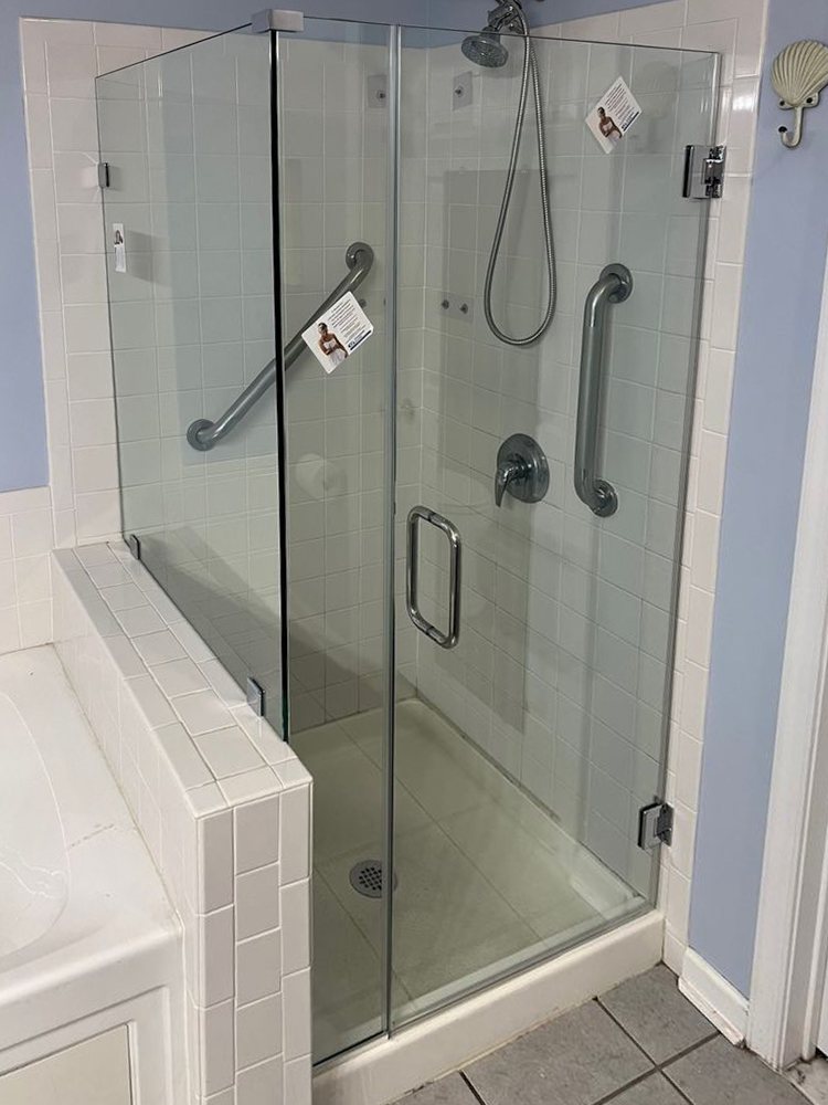 Frameless glass door and panel on the same tile knee wall, after replacement